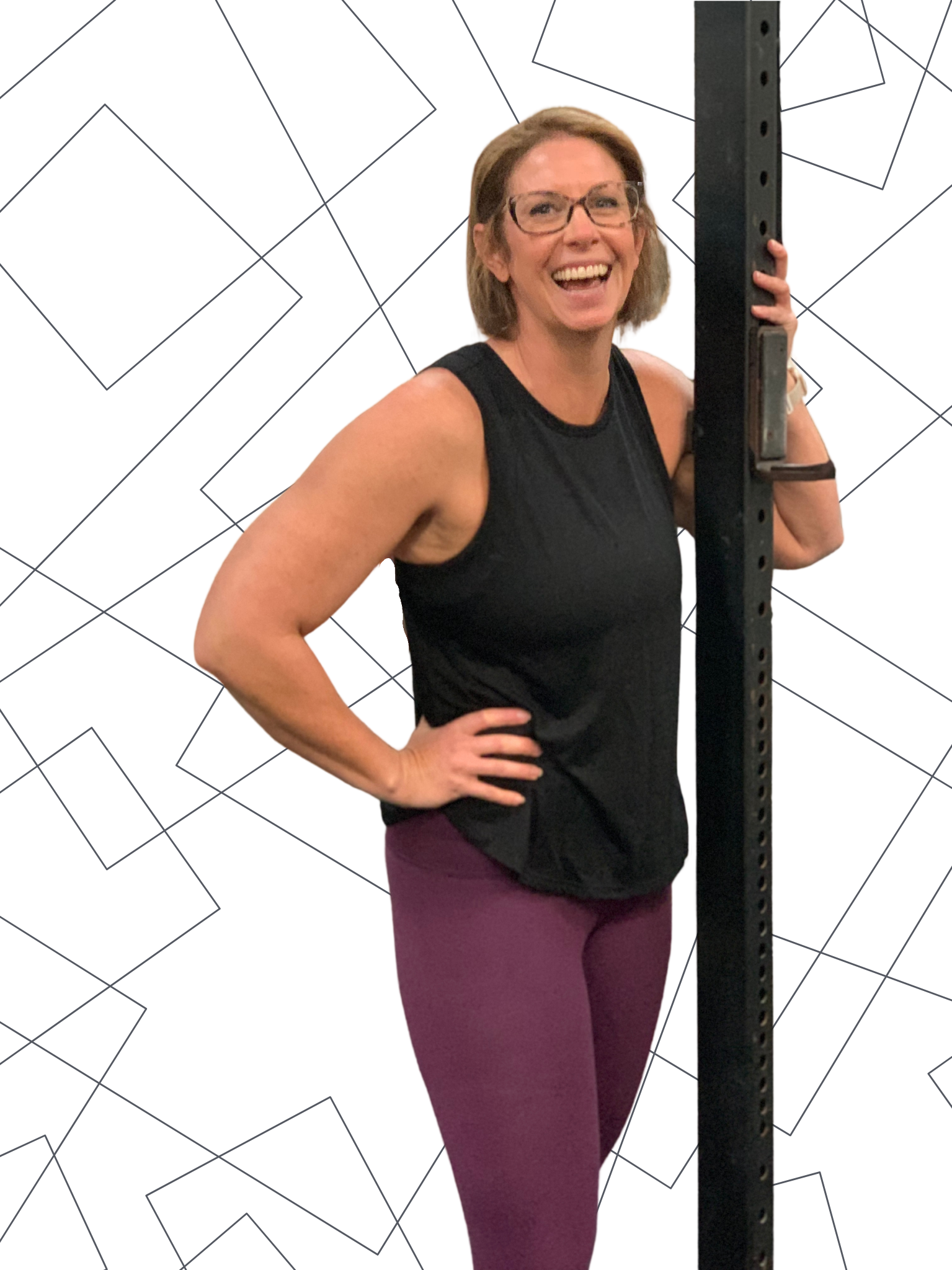 smiling woman posing in crossfit gym